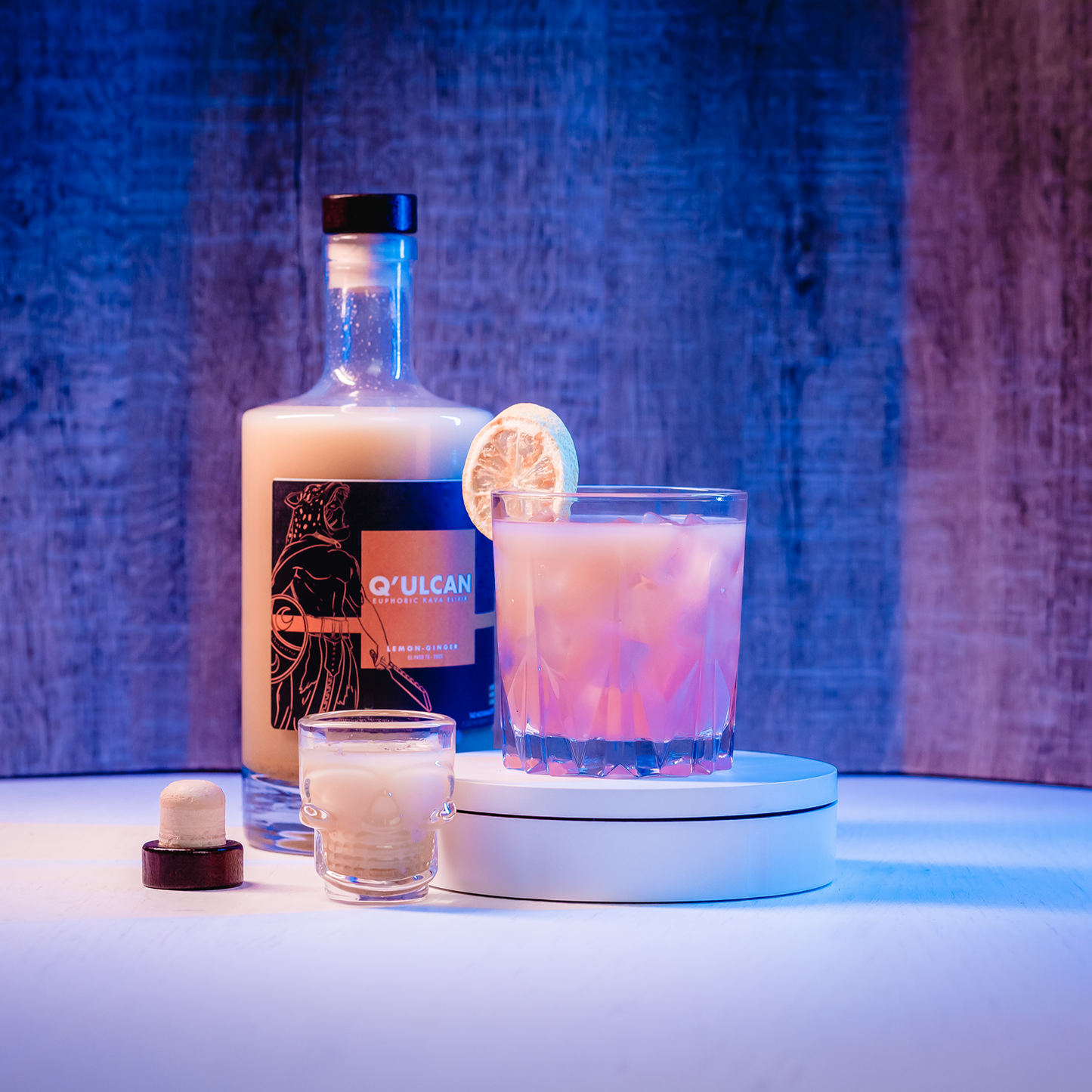 Bottle of Elevating Kava Elixer with Cocktail Glasses