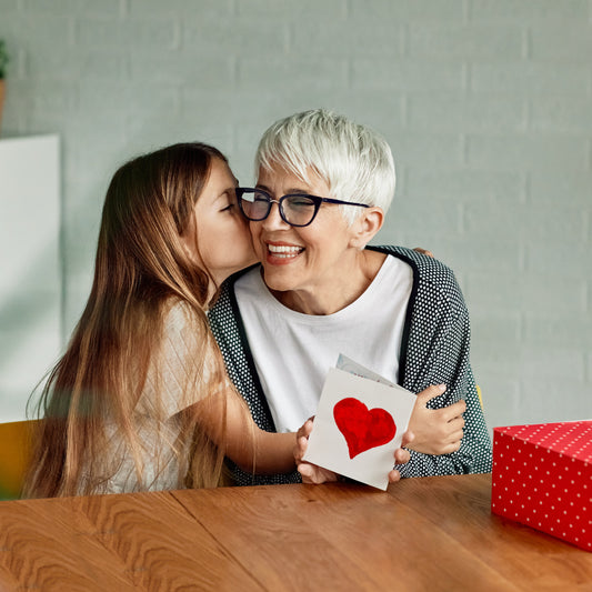 Young girl gifting grandmother